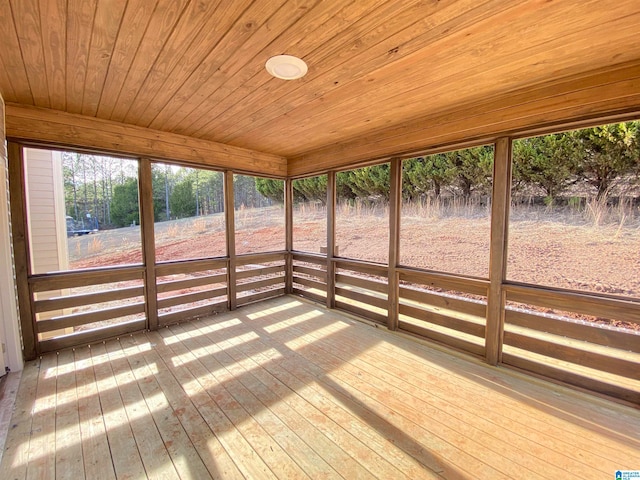 unfurnished sunroom featuring wood ceiling