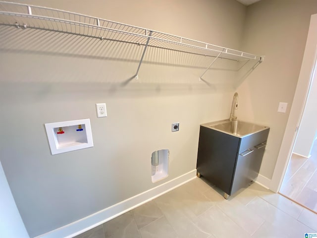 washroom with washer hookup, hookup for an electric dryer, sink, and light tile flooring