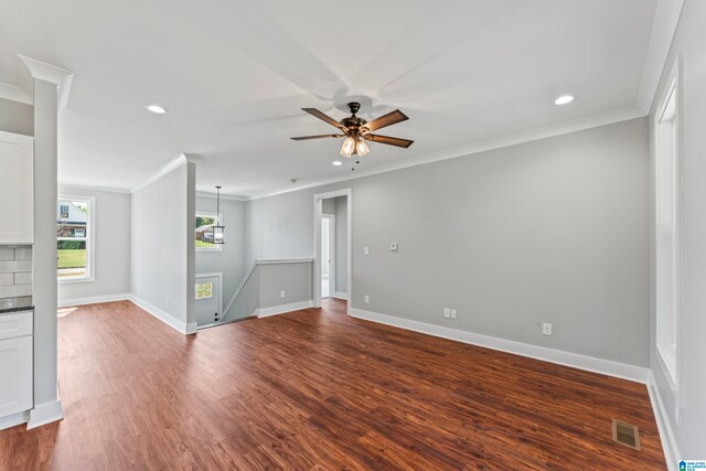 spare room with ceiling fan, ornamental molding, and hardwood / wood-style floors