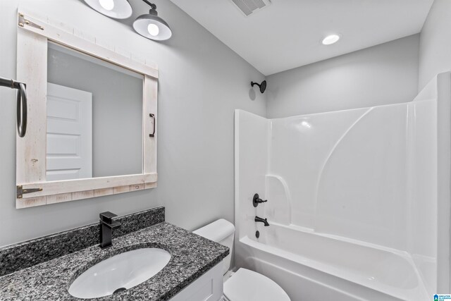 full bathroom with vanity, toilet, and bathtub / shower combination