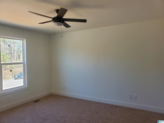 carpeted empty room with ceiling fan