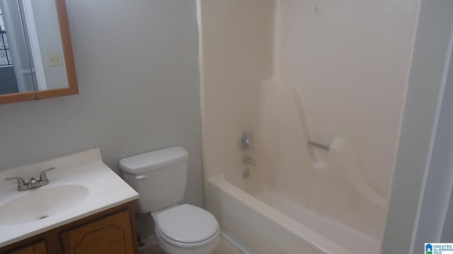 full bathroom featuring bathing tub / shower combination, toilet, and vanity
