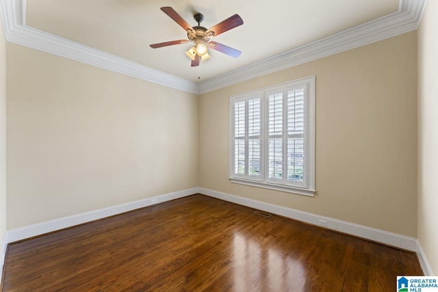 empty room with ceiling fan, dark wood-type flooring, and ornamental molding