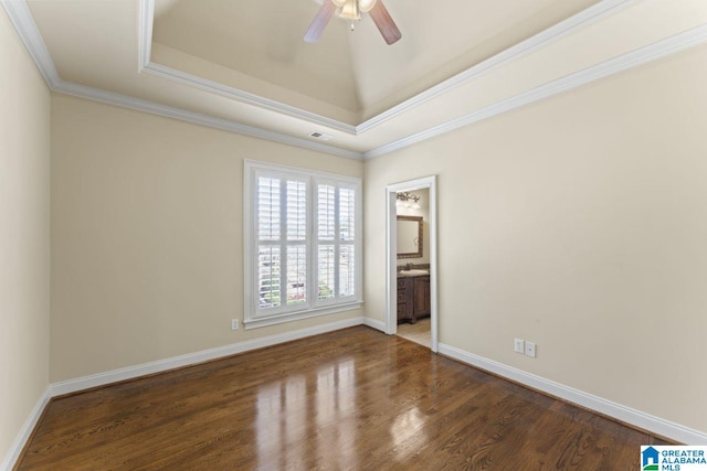 unfurnished room with ceiling fan, ornamental molding, and dark wood-type flooring