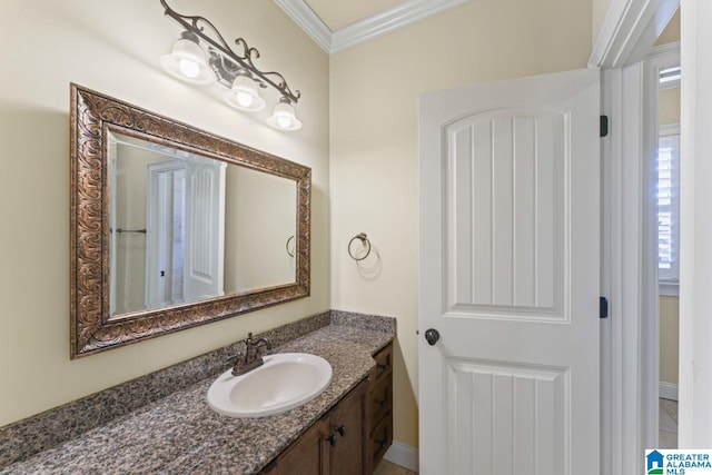 bathroom featuring large vanity and ornamental molding