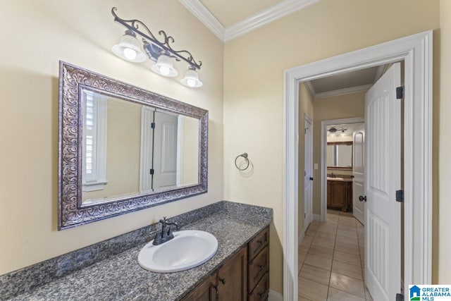 bathroom with crown molding, tile floors, and large vanity