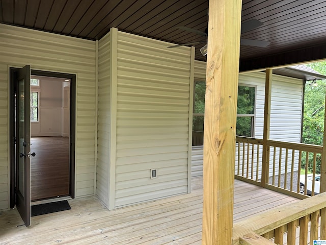 wooden deck featuring ceiling fan