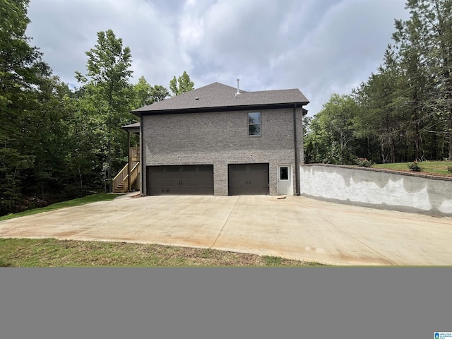 view of side of property with a garage