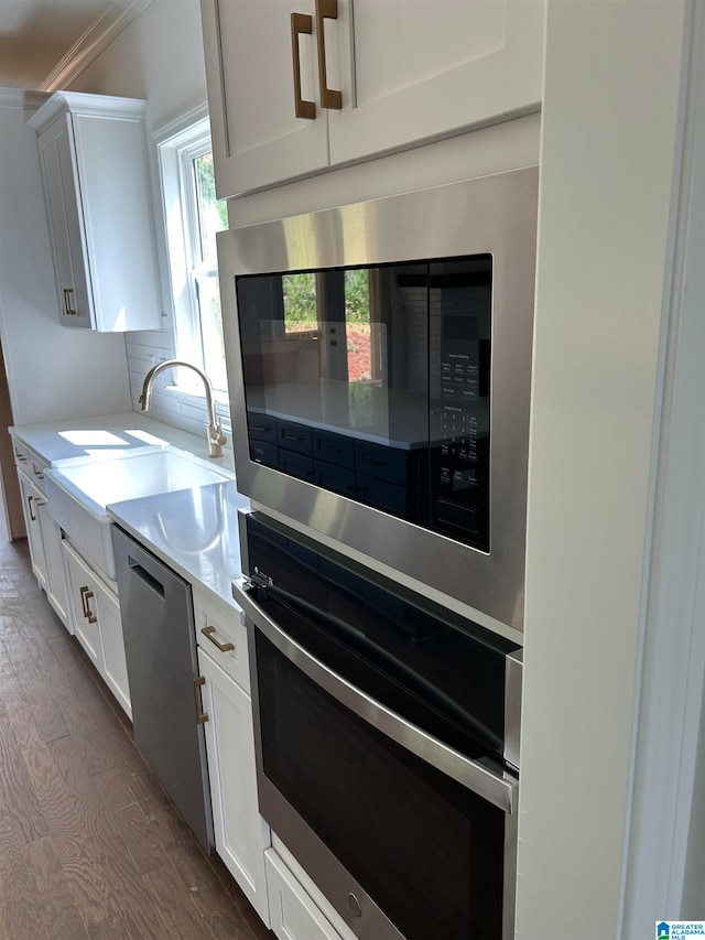 kitchen featuring white cabinetry and stainless steel appliances