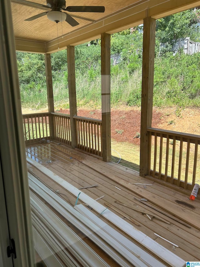 wooden deck featuring ceiling fan