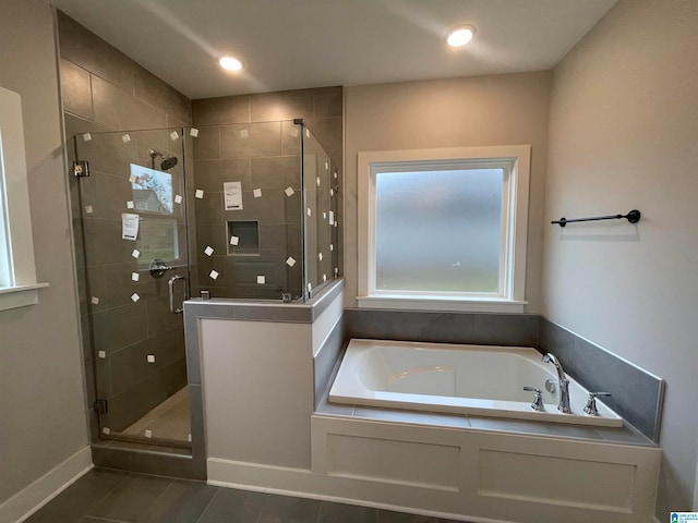 bathroom featuring plus walk in shower