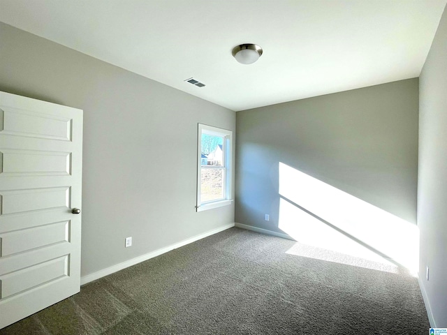 spare room featuring carpet floors