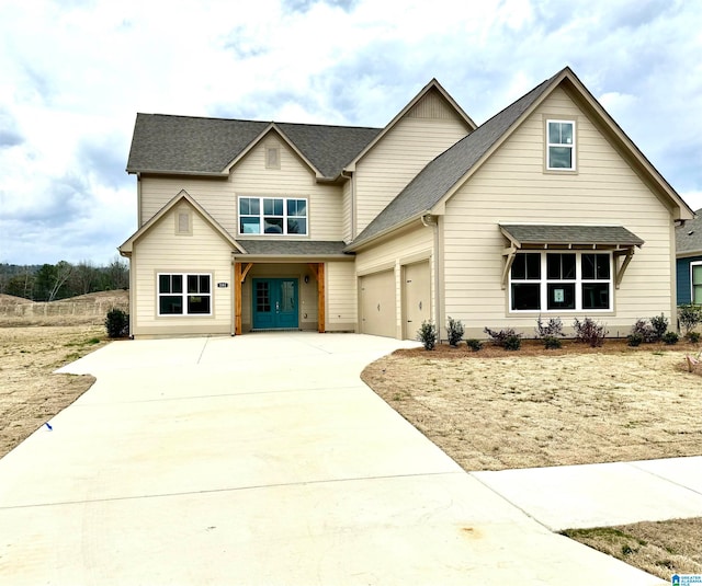 view of front of home with french doors and a garage