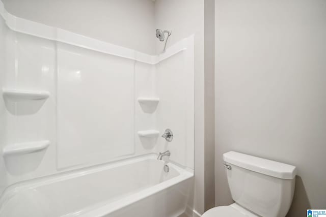 bathroom featuring toilet and tub / shower combination