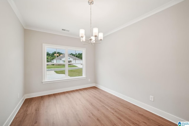 unfurnished room with light hardwood / wood-style floors, ornamental molding, and a notable chandelier