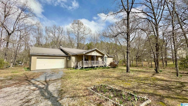 view of front facade with a porch and a garage