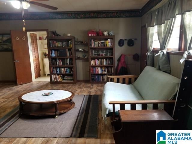 living room with ceiling fan and light hardwood / wood-style floors