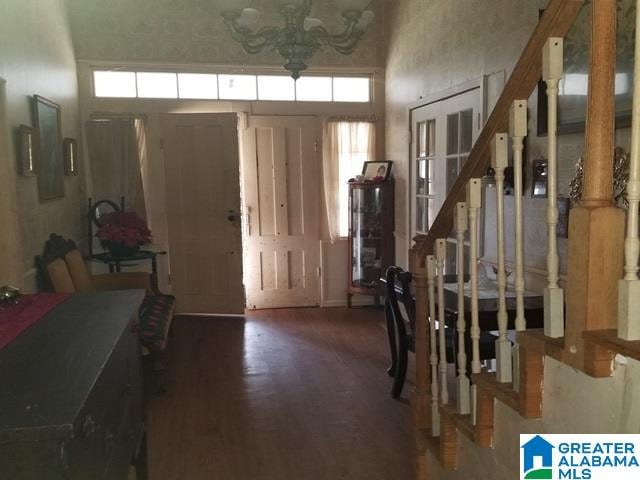 entryway featuring a chandelier