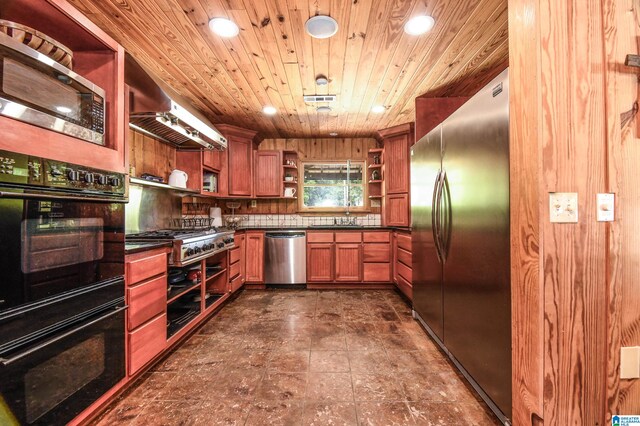 kitchen featuring wall chimney range hood, tasteful backsplash, wooden ceiling, dark tile flooring, and appliances with stainless steel finishes