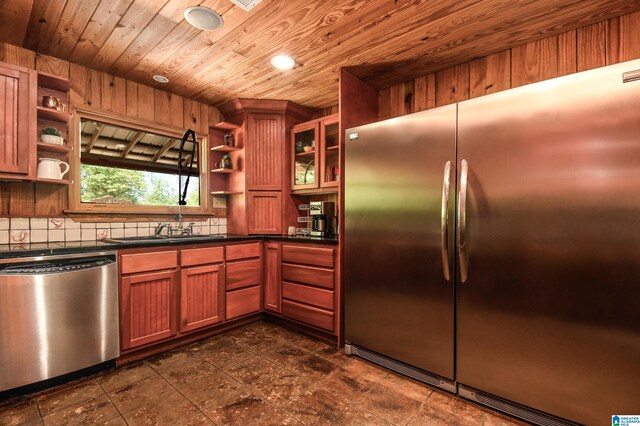 kitchen with stainless steel appliances, dark tile flooring, backsplash, and wood ceiling