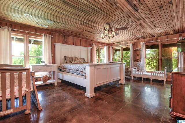 tiled bedroom featuring wooden walls, ceiling fan, wood ceiling, and multiple windows