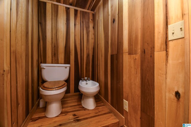 bathroom with a bidet and toilet