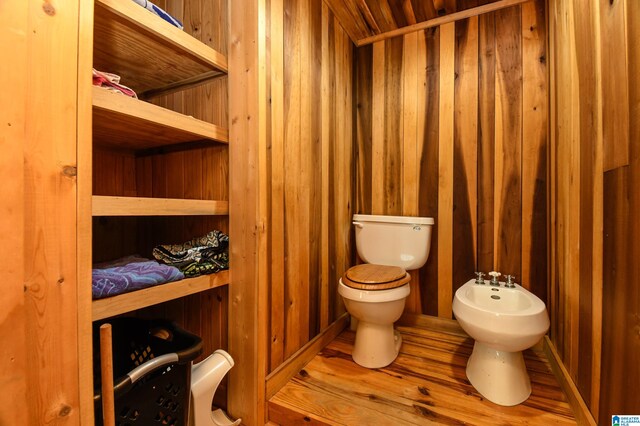 bathroom with a bidet and toilet