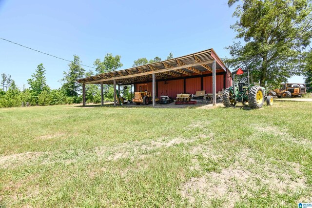 rear view of house with a yard and a carport