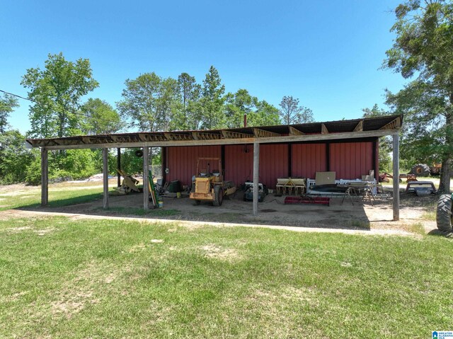 exterior space with a yard and a carport