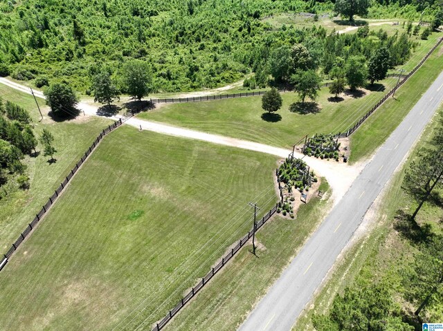 birds eye view of property with a rural view