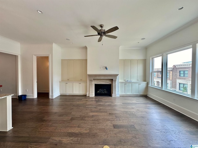 unfurnished living room featuring ornamental molding, dark hardwood / wood-style floors, and ceiling fan