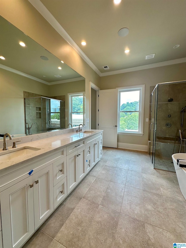 bathroom featuring crown molding, shower with separate bathtub, vanity, and plenty of natural light