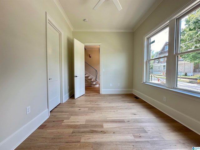 unfurnished bedroom with light hardwood / wood-style flooring and ornamental molding