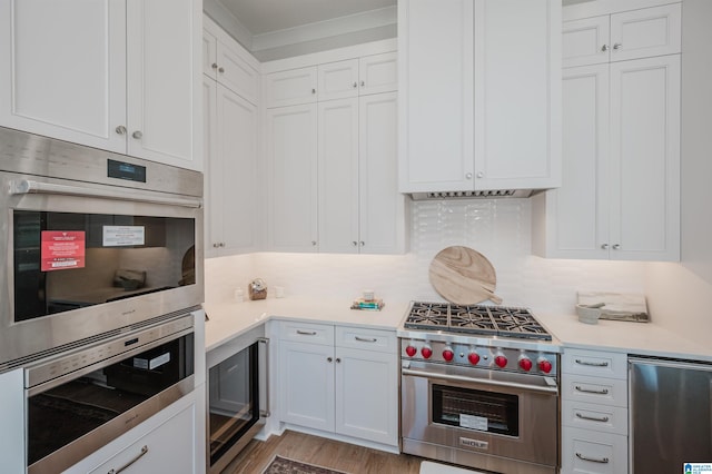 kitchen with white cabinetry, light countertops, and stainless steel appliances