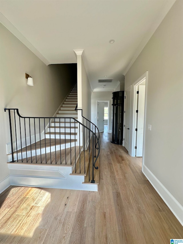 stairway featuring hardwood / wood-style flooring