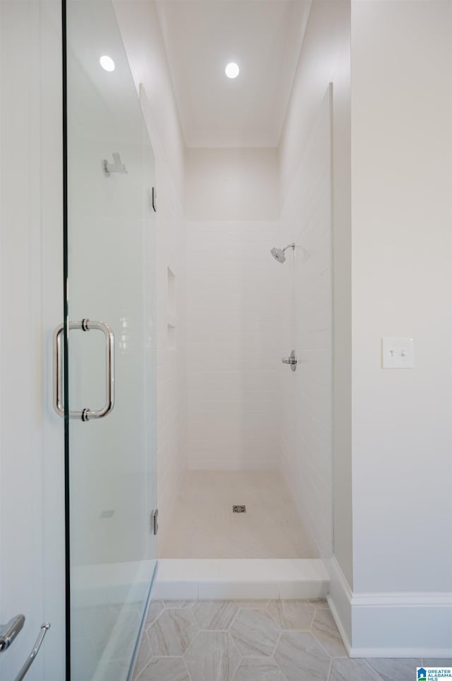 bathroom with a shower stall