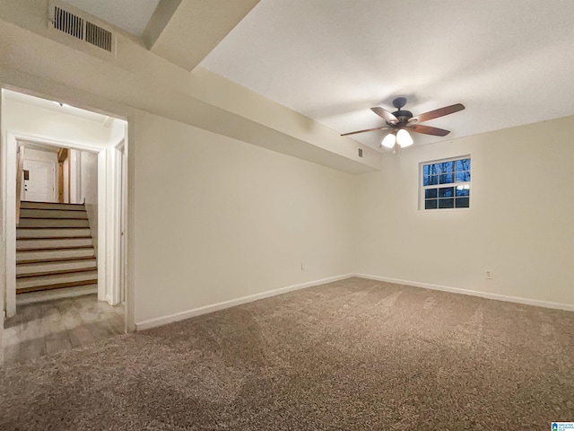 carpeted empty room featuring ceiling fan