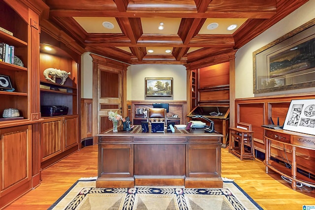 office area with beamed ceiling, light hardwood / wood-style flooring, coffered ceiling, and built in features