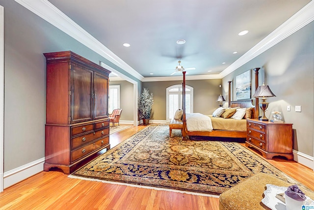 bedroom featuring light hardwood / wood-style floors and crown molding