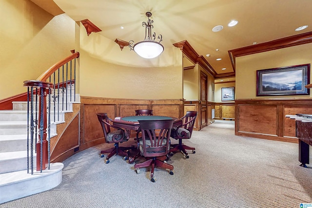 dining space with crown molding and carpet