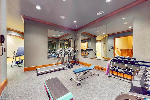 exercise room featuring ornamental molding