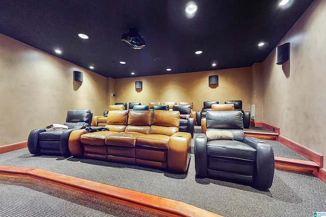 cinema room featuring carpet flooring