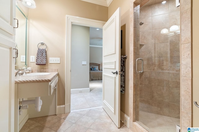 bathroom featuring vanity with extensive cabinet space, crown molding, an enclosed shower, and tile floors