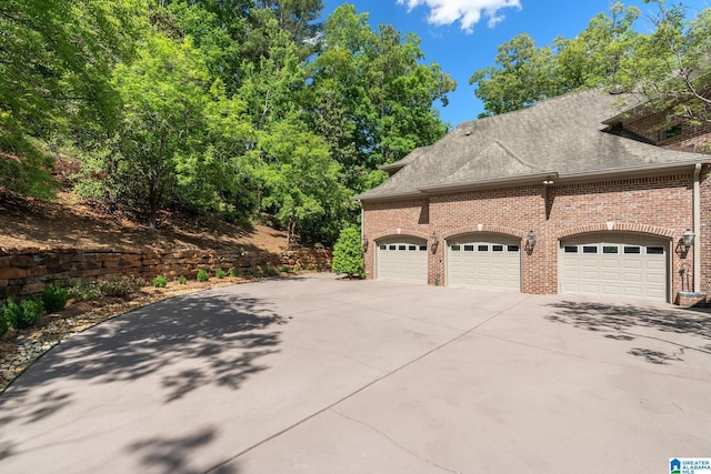 view of property exterior with a garage