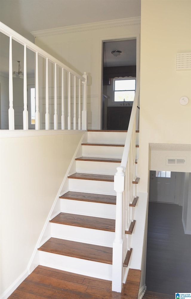 stairway featuring dark hardwood / wood-style floors