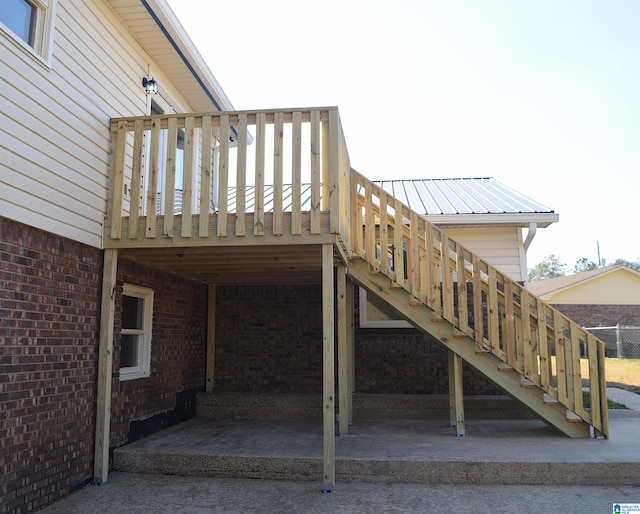 rear view of house with a deck and a patio area