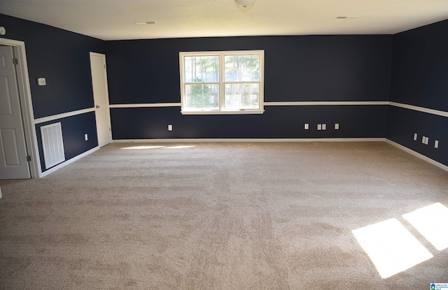 unfurnished room with light colored carpet