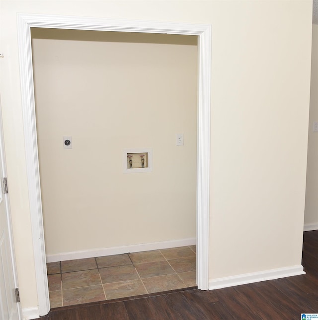 washroom featuring hookup for a washing machine, hookup for an electric dryer, and dark tile floors