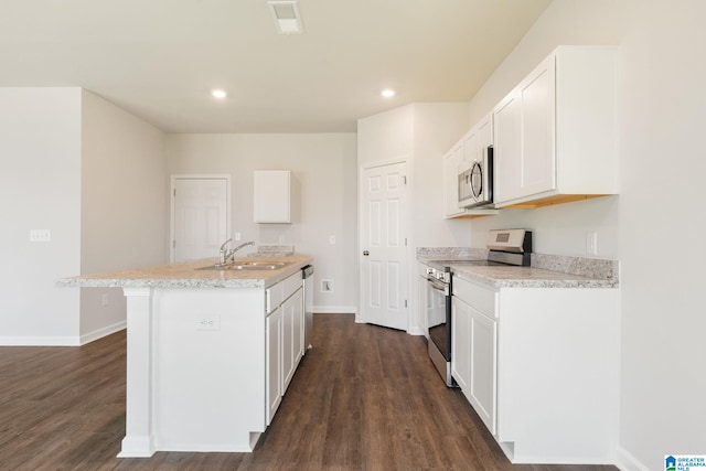 kitchen featuring sink, white cabinetry, dark hardwood / wood-style flooring, a kitchen island with sink, and appliances with stainless steel finishes