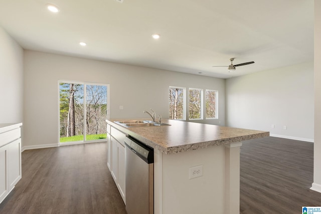 kitchen featuring sink, white cabinetry, ceiling fan, stainless steel dishwasher, and a kitchen island with sink